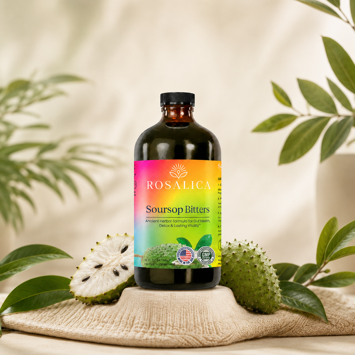 ROSALICA Soursop Bitters bottle displayed with fresh soursop fruit and botanical leaves