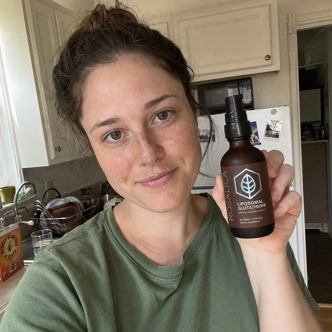 Person holding Rosalica Liposomal Glutathione