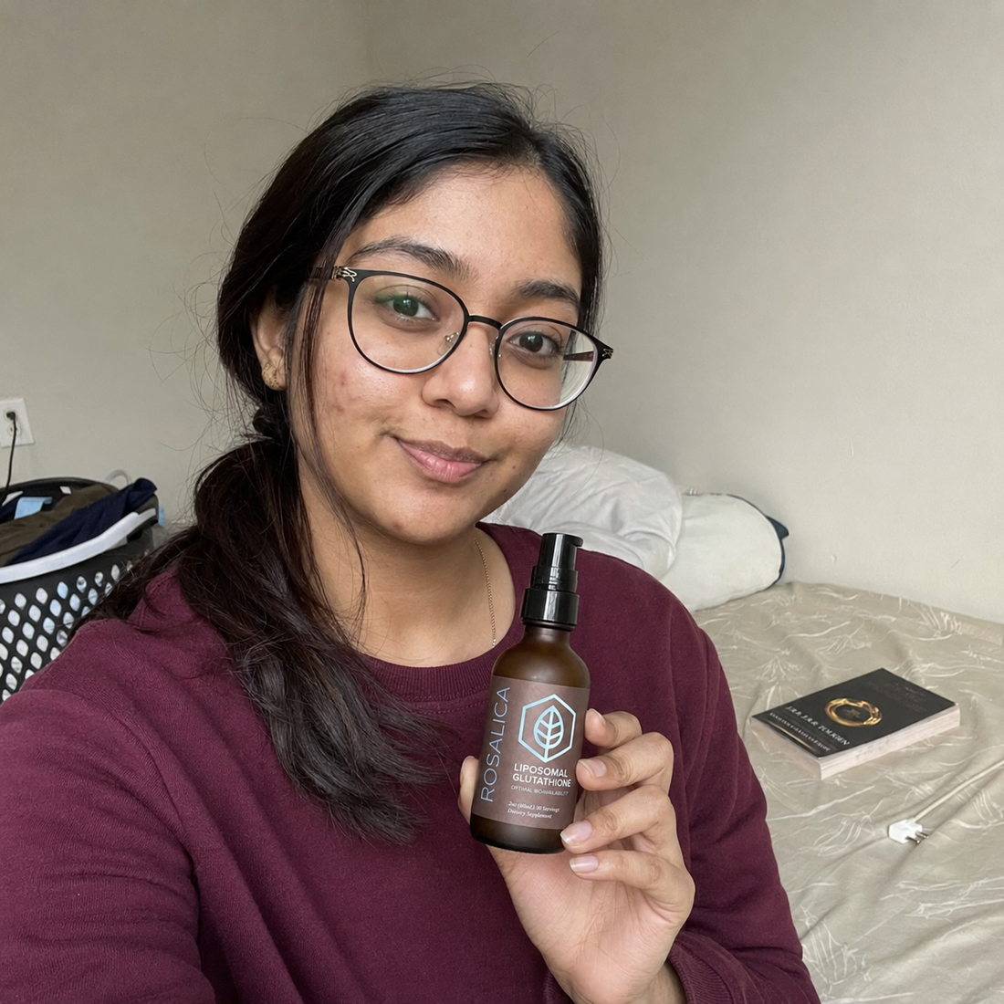 Person holding Rosalica Liposomal Glutathione