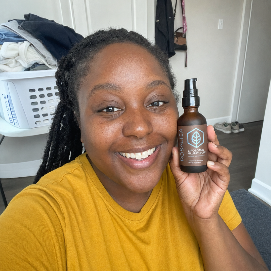 Person holding Rosalica Liposomal Glutathione