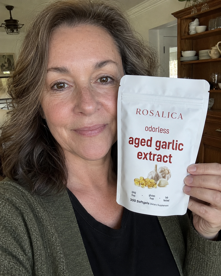 Middle aged customer holding ROSALICA Aged Garlic Extract